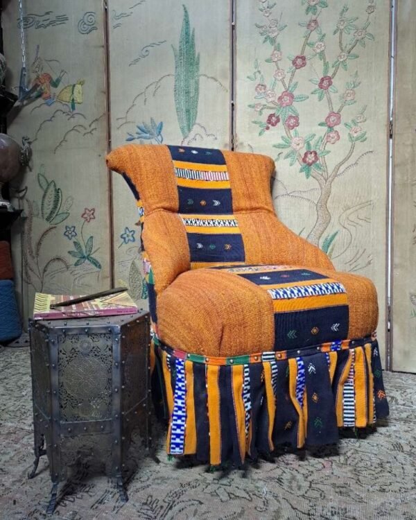 Antique iron back chair with vintage African Kente cloth