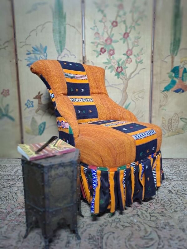Antique iron back chair with vintage African Kente cloth