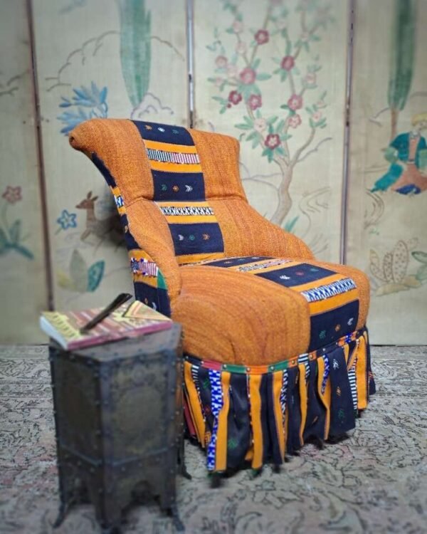 Antique iron back chair with vintage African Kente cloth